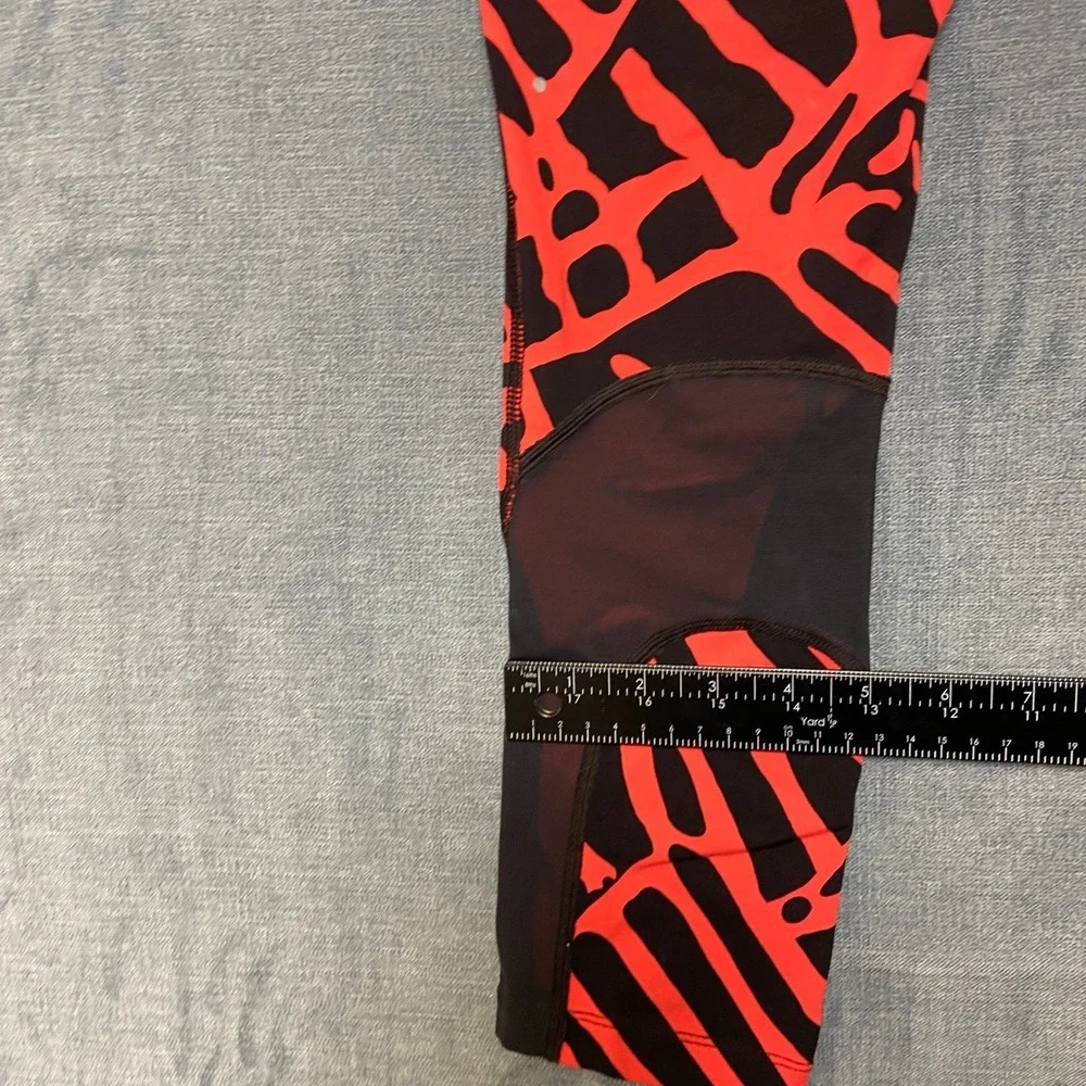 Nike Dri Fit Power Epic Lux Capri Leggings Womens XS Black Orange Abstract Print